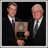 Discussion Meet Award—Kaleb Rathbone, of Haywood County Farm Bureau, receives the award from NCFB Vice President J.M. Wright Jr. (right).