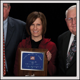 Achievement Award—Brent and Sue Leggett, of Nash County Farm Bureau, receive the award from NCFB Vice President J.M. Wright Jr. (right).